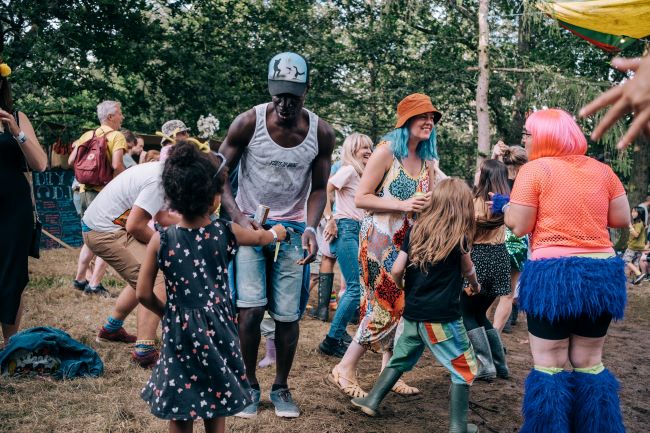 Families dancing at Elderflower Fields Festival near Brighton.